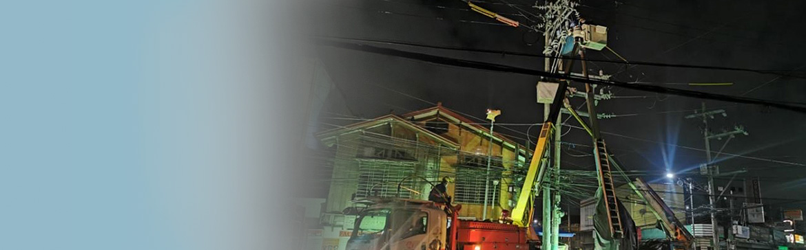 Meralco employees working on pole relocation