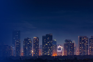A bright, lit up cityscape at night
