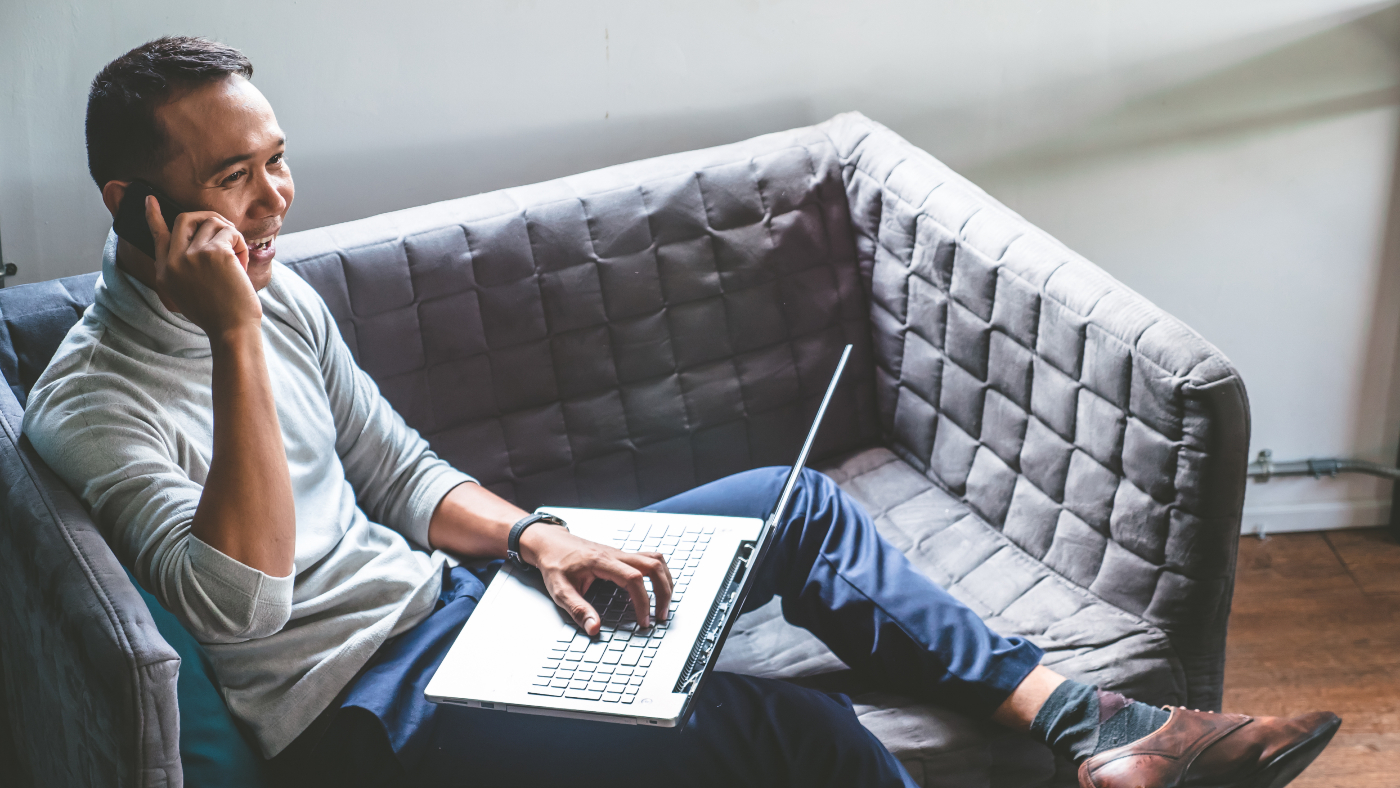 Man using his laptop and phone